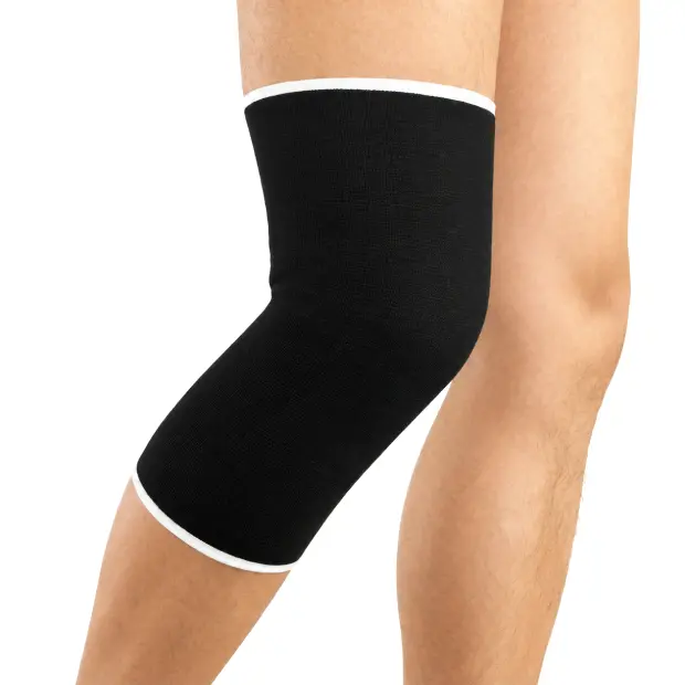 Black knee sleeve on bent leg.webp