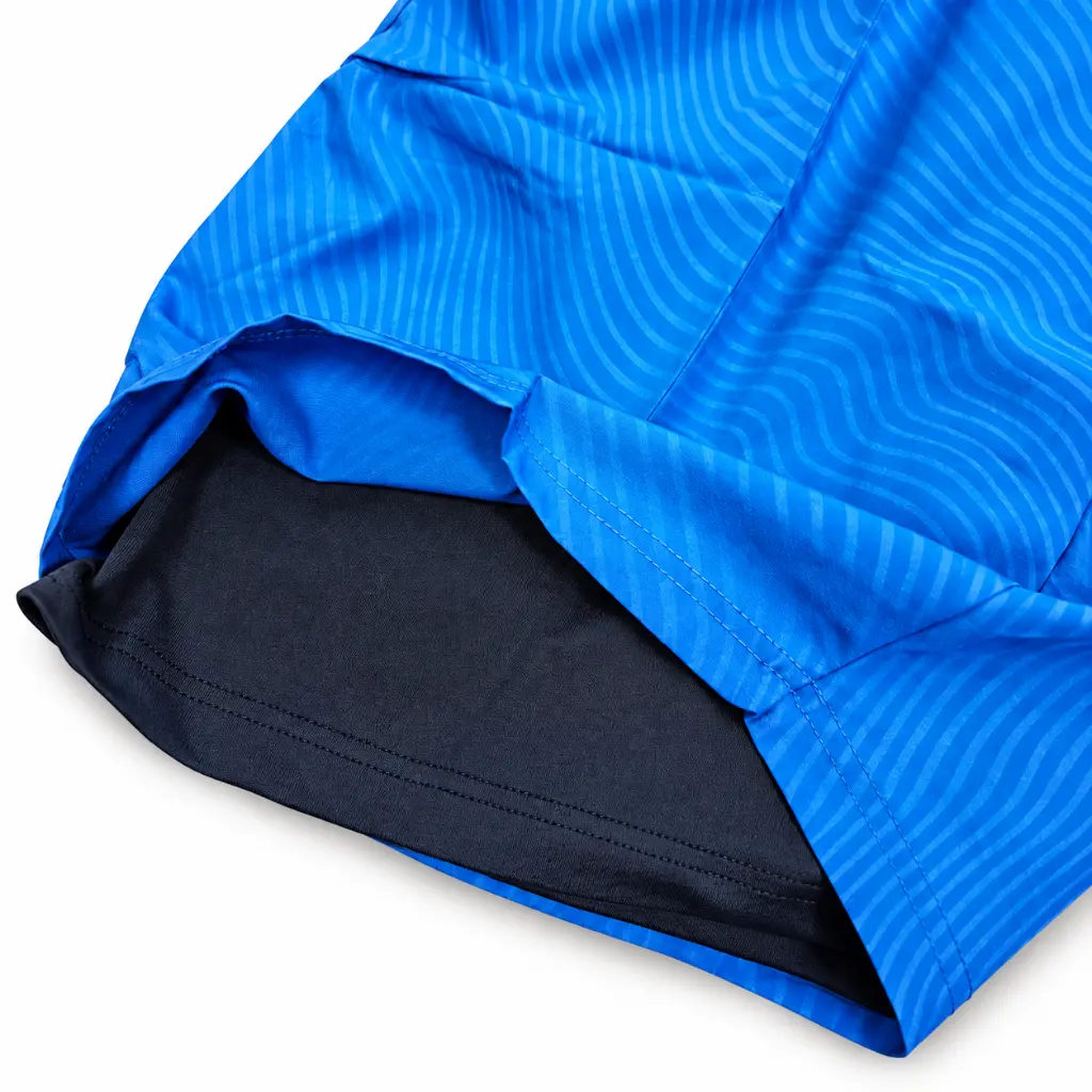 Blue hem reveals attached dark compression liner.webp